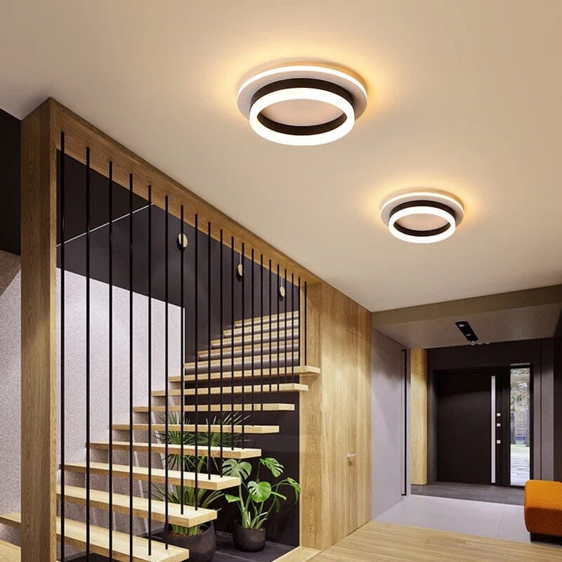 Maintained House Floating Ring LED Ceiling Light - Round in Black above a floating staircase