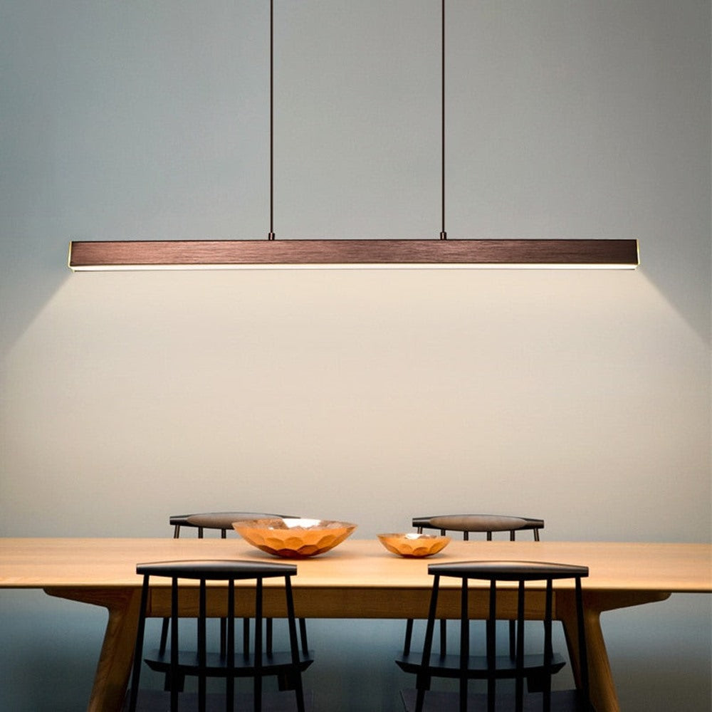 Maintained House Linear LED Bar Pendant Light - Brushed Coffee over a dining table