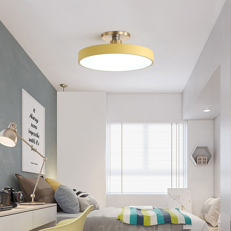 Maintained House Macaron Drum LED Ceiling Light - Yellow in a bright bedroom