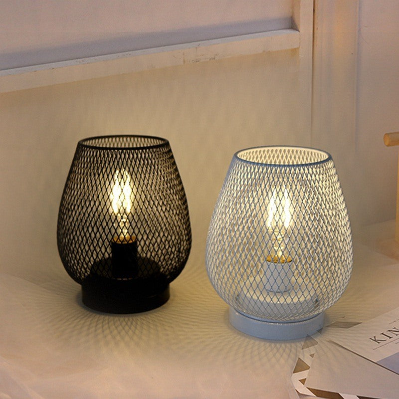 Maintained House Mesh Cage Cordless Table Lamp - Black and White lamps glowing on a side table
