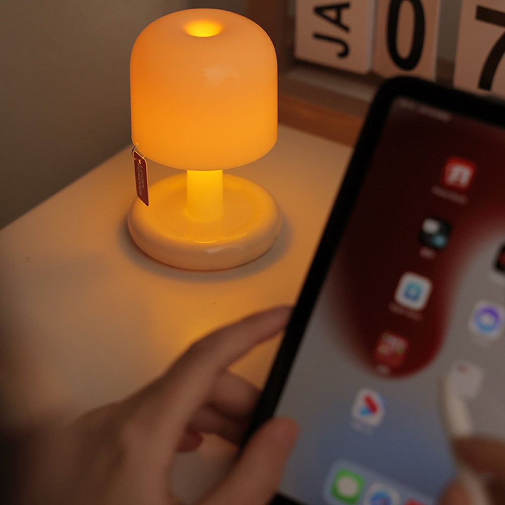 Maintained House Mini Sunset Mushroom Lamp - Glowing beside a tablet