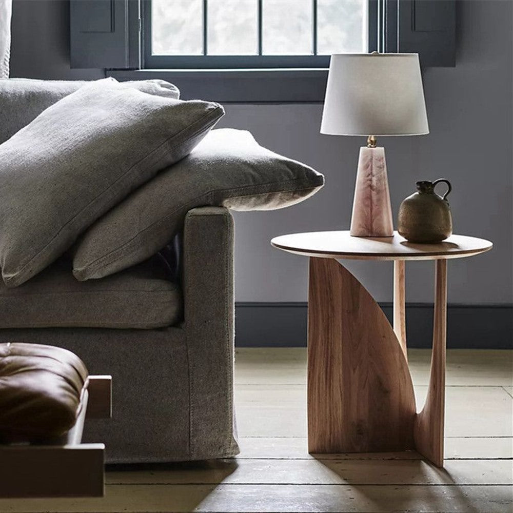 Maintained House Sculpted Round Side Table - Walnut Finish by a reading lamp