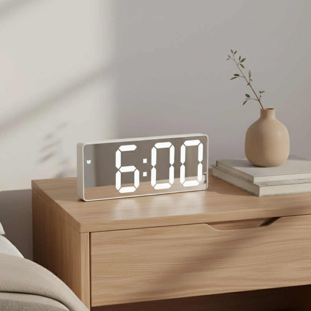Maintained House Slim LED Temperature Alarm Clock - White mirror on a nightstand