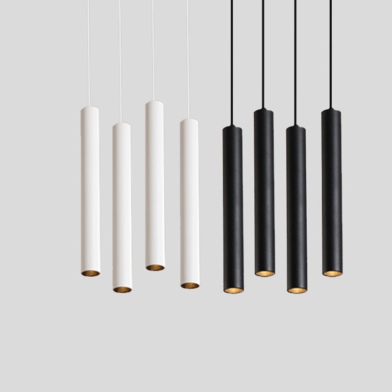 Maintained House Slim Tube LED Pendant Light - White and black tubes hung at staggered heights