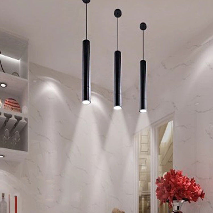Maintained House Slim Tube LED Pendant Light - Three black tubes casting pools of light