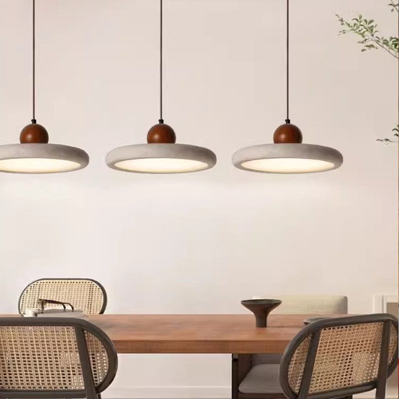 Maintained House Travertine Disc Pendant Light - Walnut trio over a table