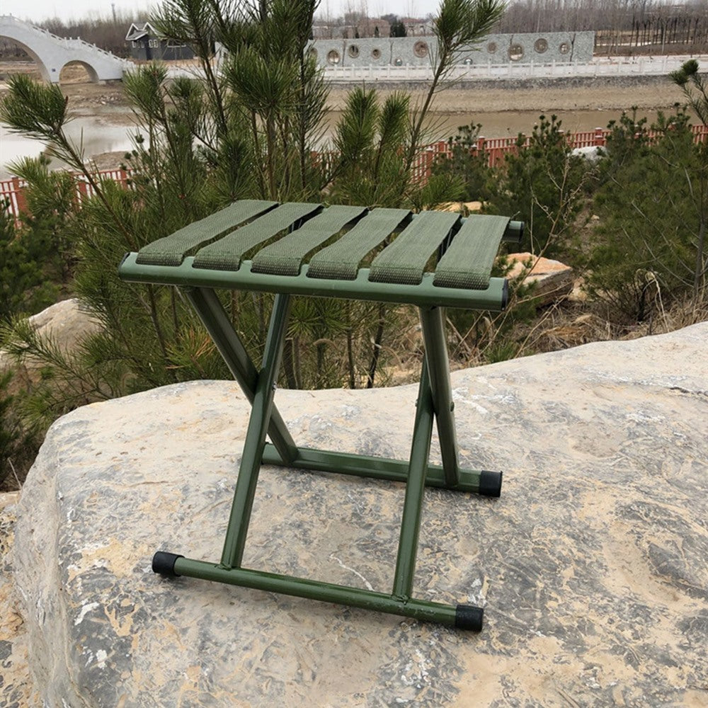 Maintained House Webbing Seat Folding Stool - Olive Green by the water
