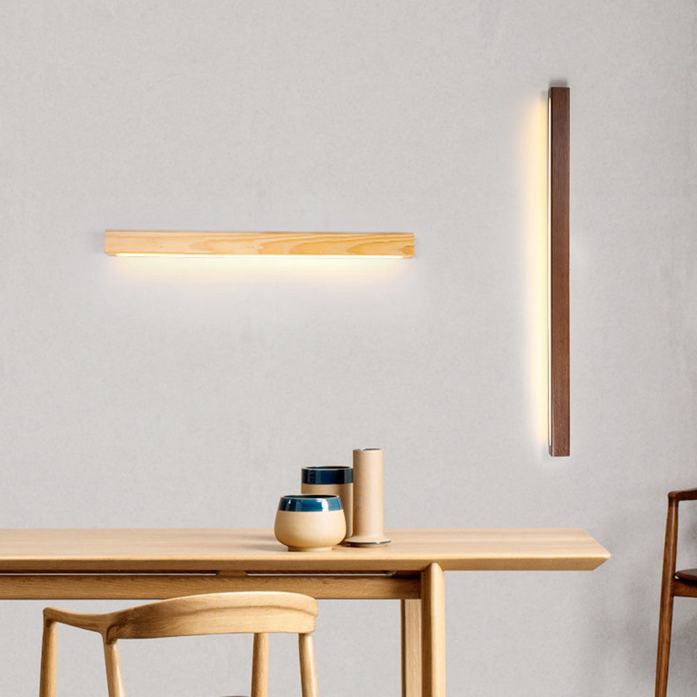 Maintained House Wood Linear LED Wall Light - Natural and walnut bars on a dining-room wall