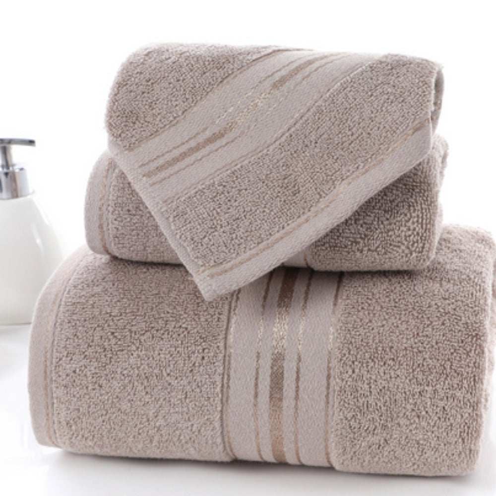Beige 3-piece luxury bath towel set with gold metallic stripe band and soap dispenser