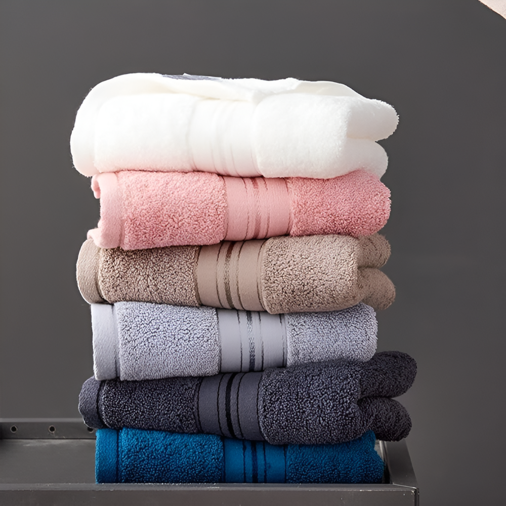 Multi-color 3-piece towel set stack showing white pink beige gray blue options