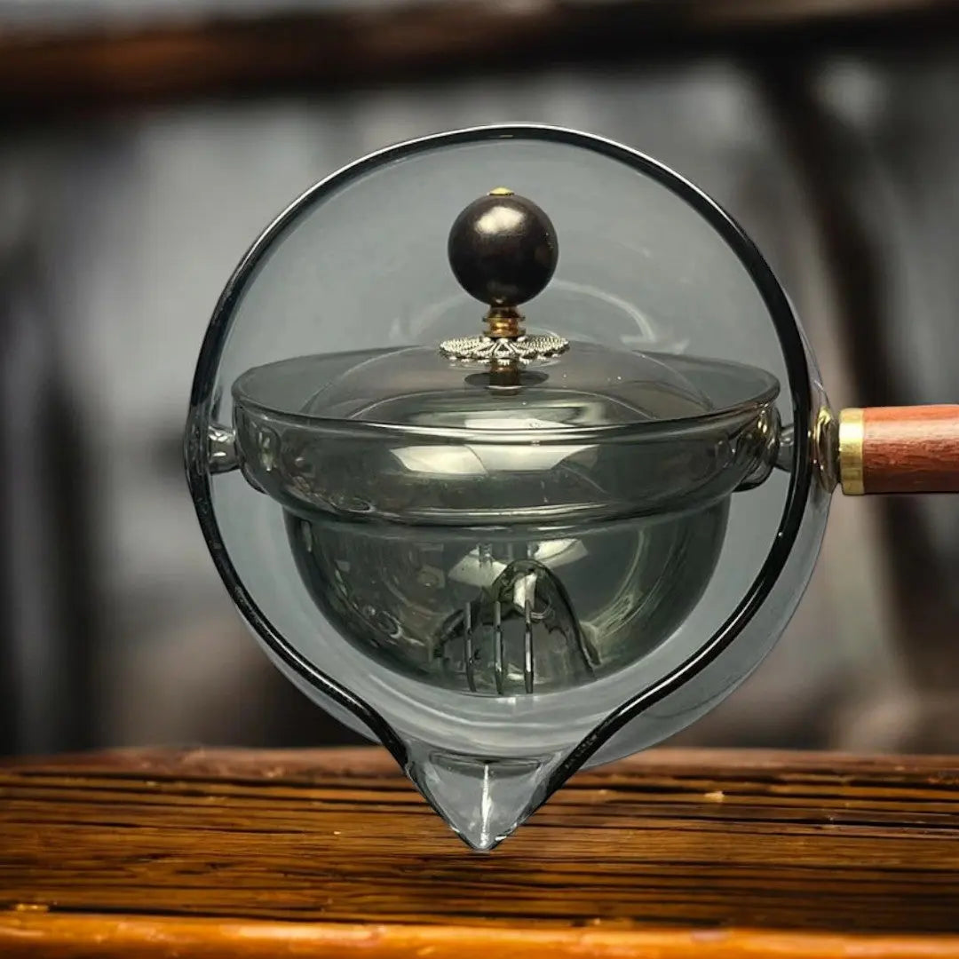 Front view smoked gray borosilicate glass teapot with internal infuser basket