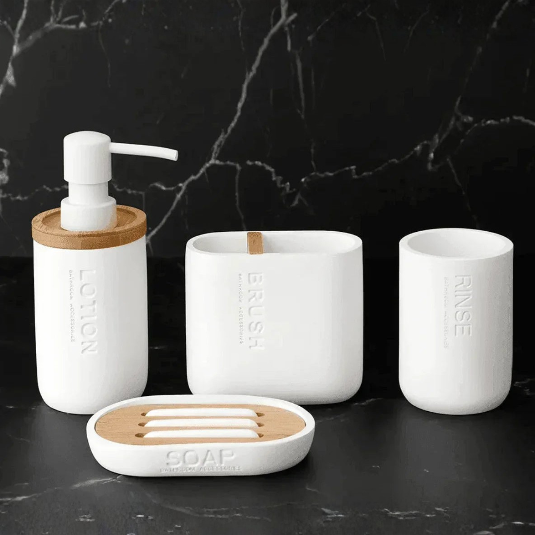 White 4-piece bathroom accessory set with natural bamboo rings on marble