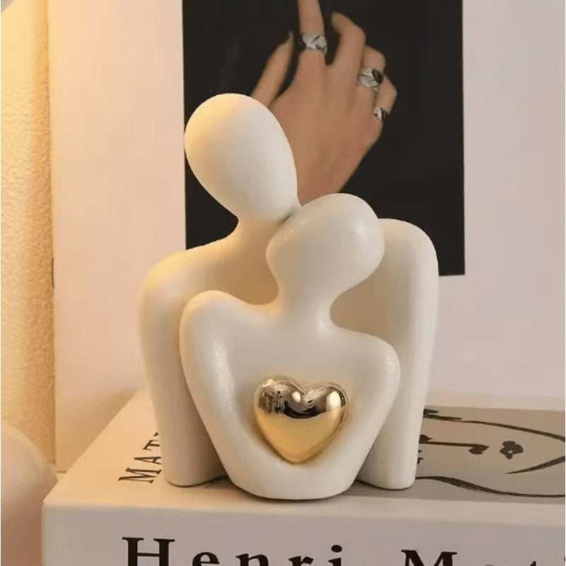 Romantic white ceramic couple art statue styled on book display