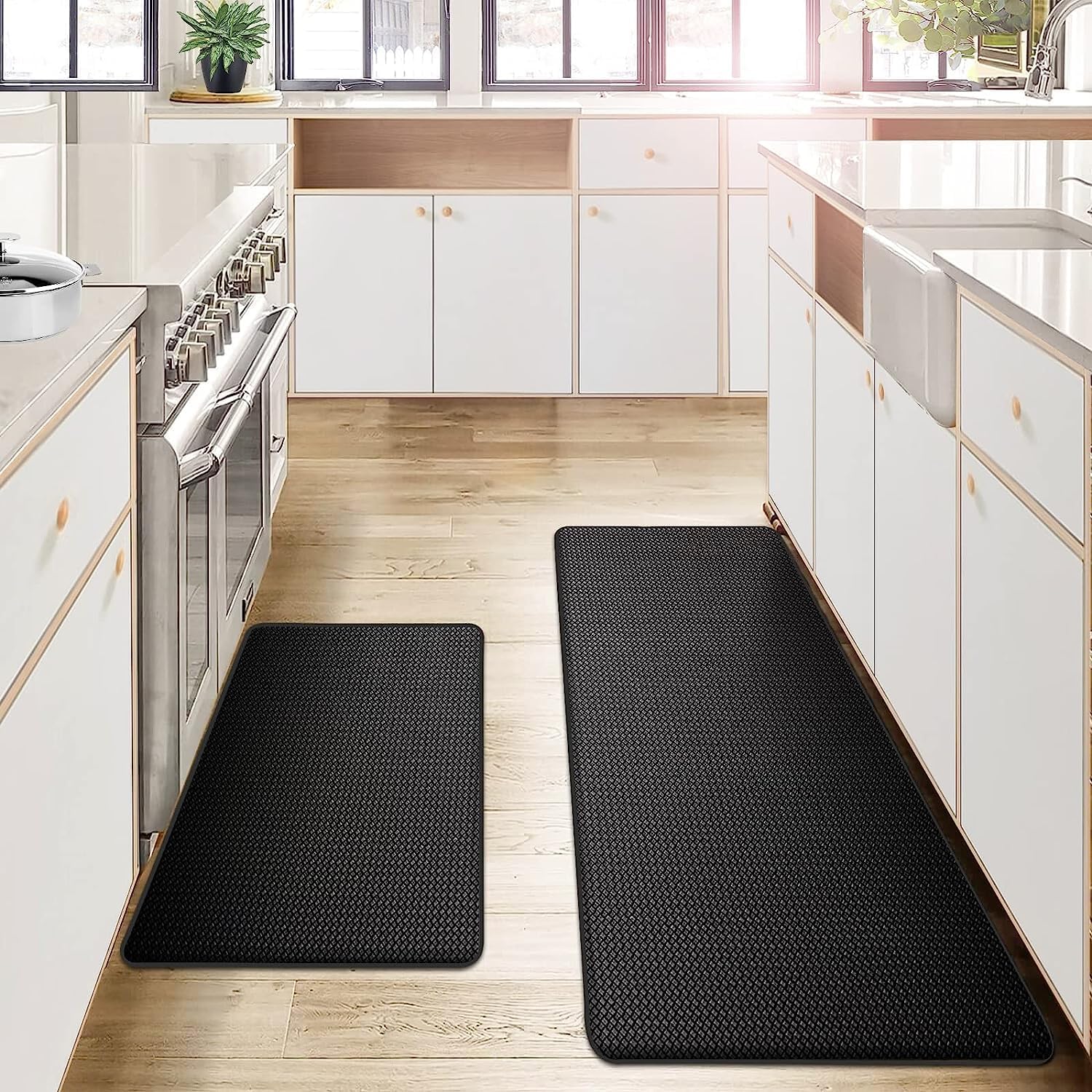 Black anti fatigue kitchen mat runner set on wood floor with diamond texture