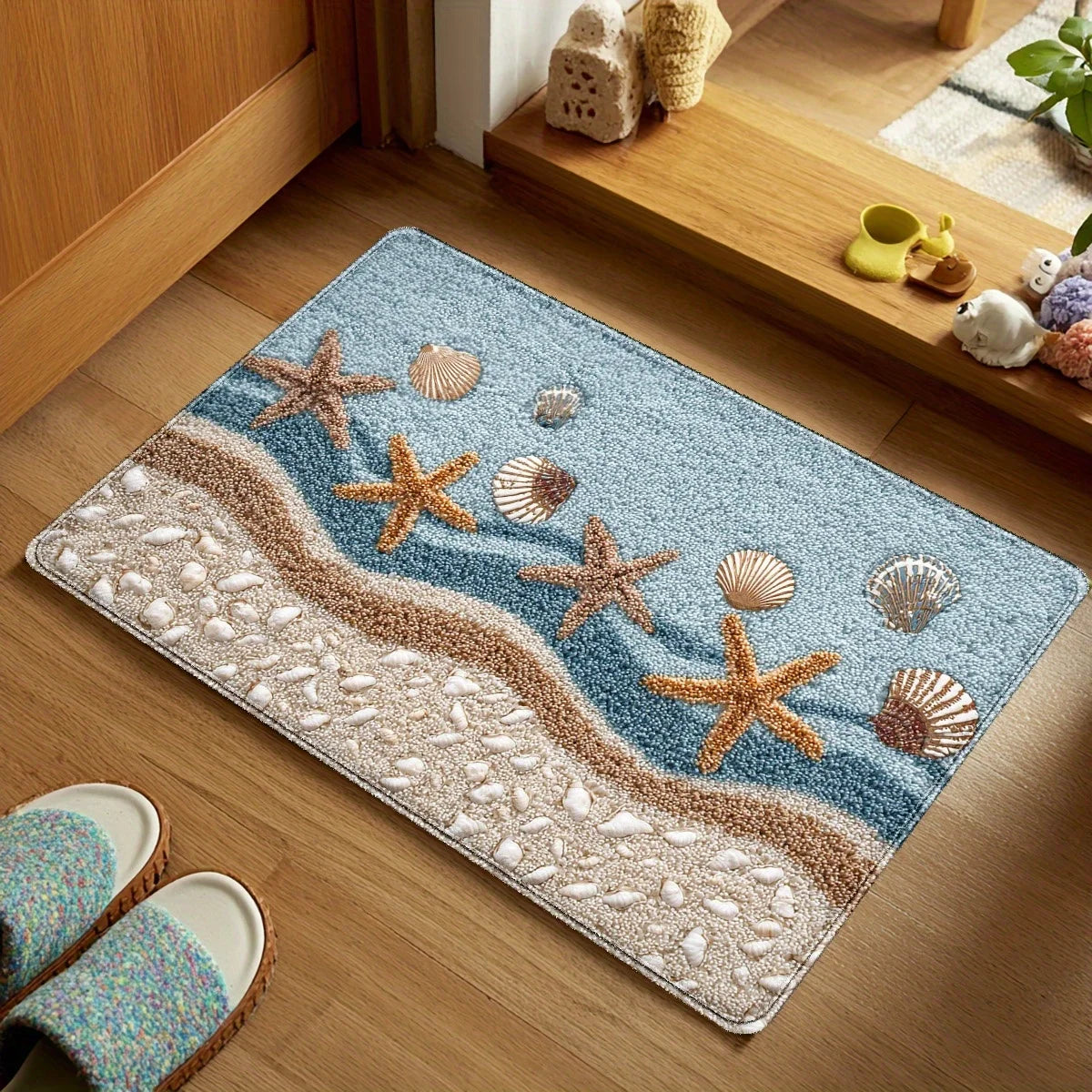 Non-slip beach rug with orange starfish and brown sand stripe design