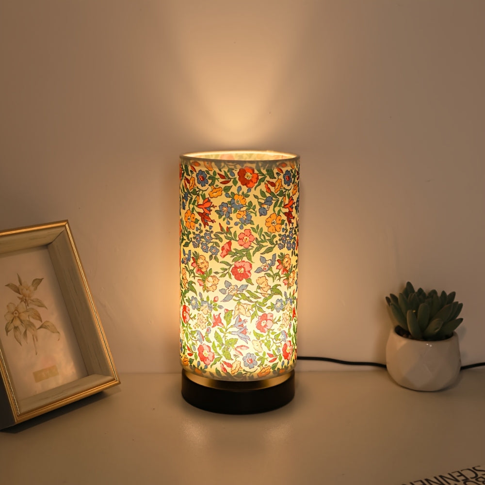 Vintage floral fabric table lamp with red and blue millefleurs pattern on cream shade