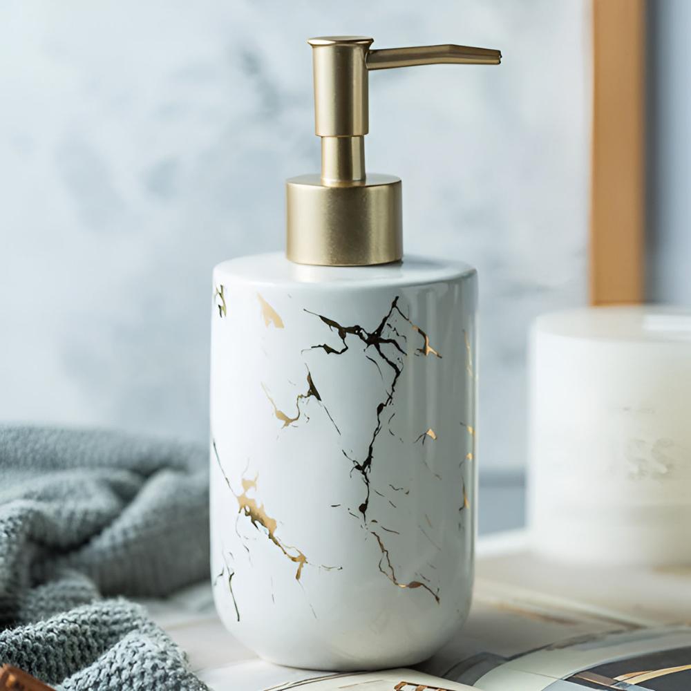 White ceramic soap dispenser with black and gold marble veining on magazine