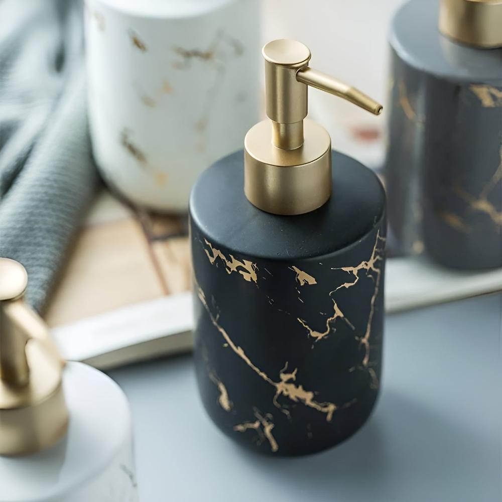 Black ceramic soap dispenser with gold marble veining next to other color variants