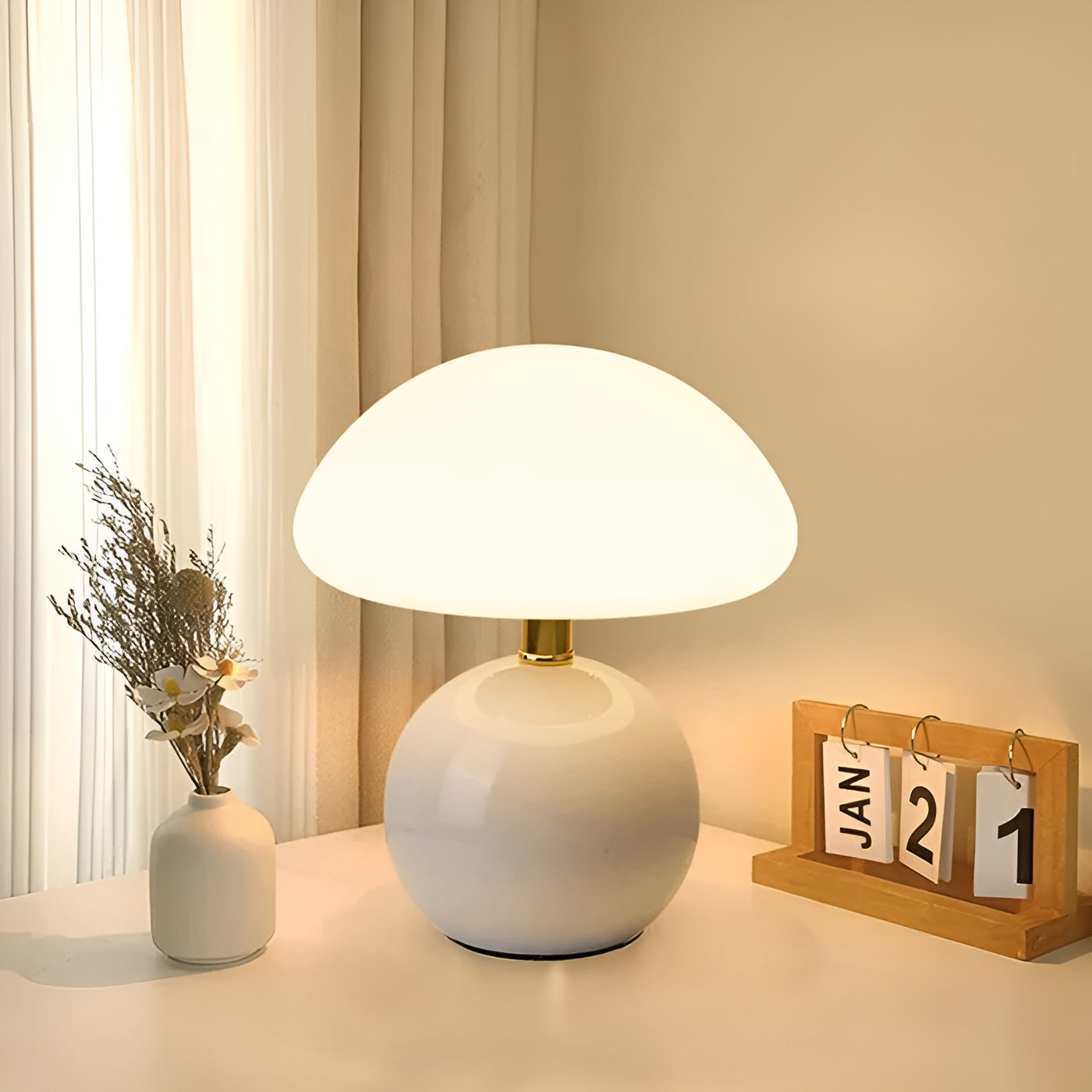 White table lamp near window with dried flowers and calendar