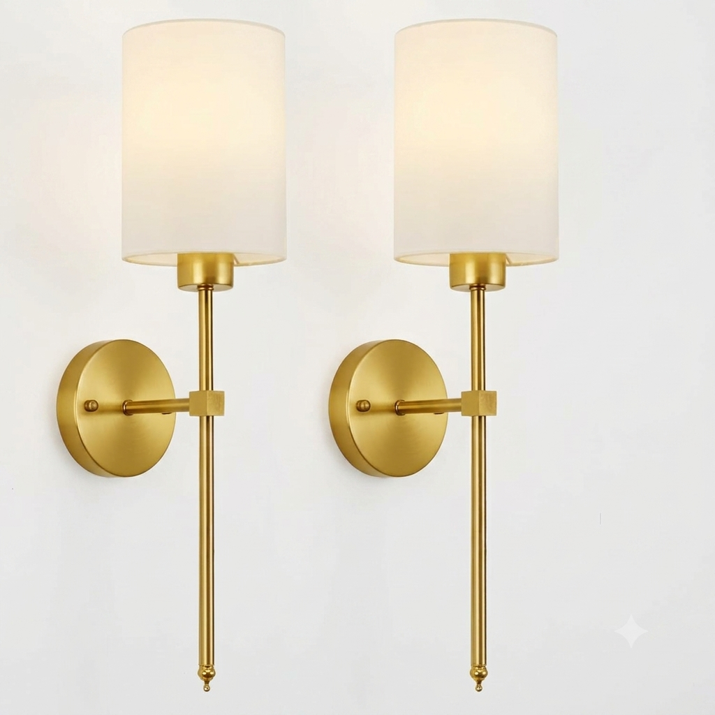 Gold finish wall sconce pair with cylindrical white fabric shade detail