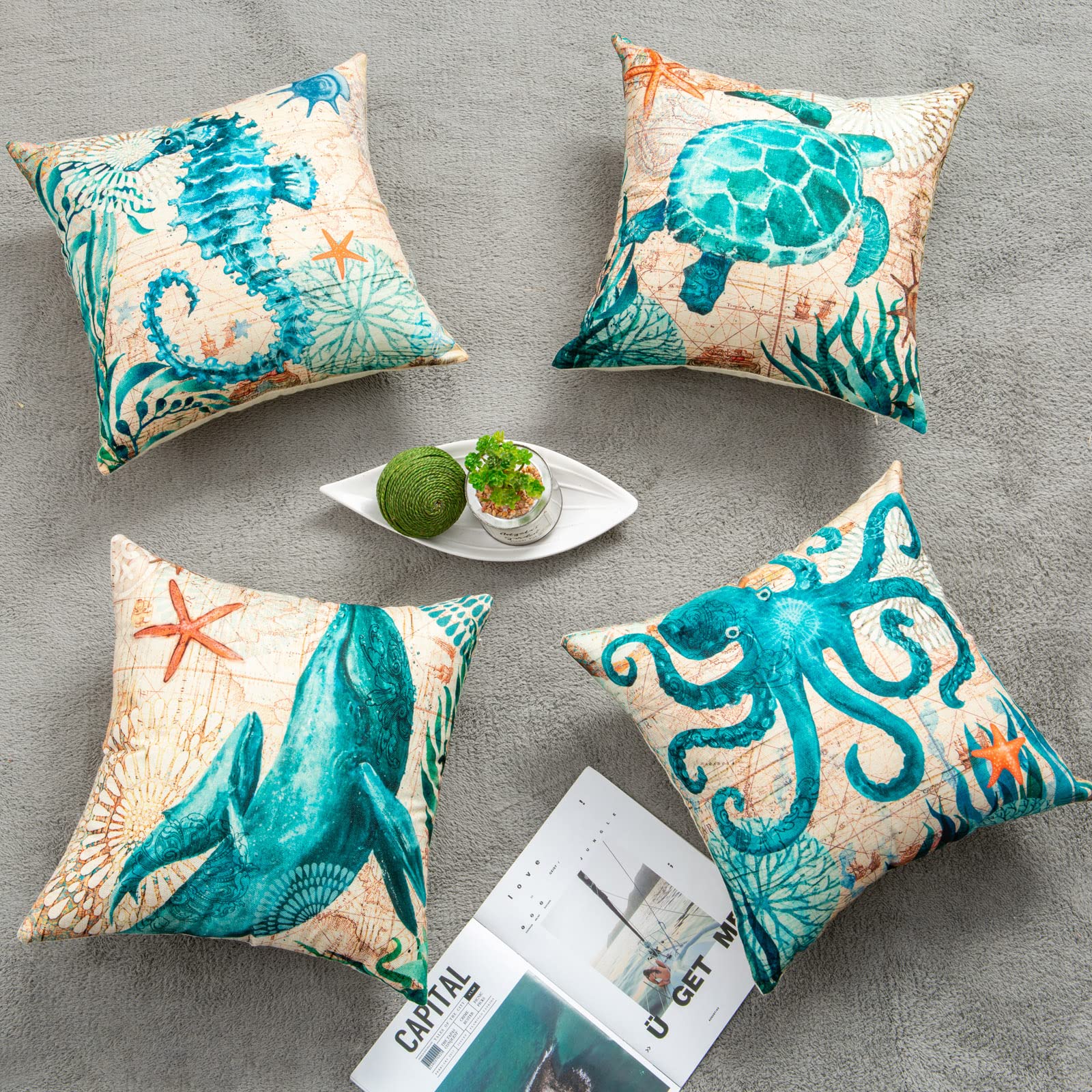Nautical marine life pillow covers arranged on gray carpet