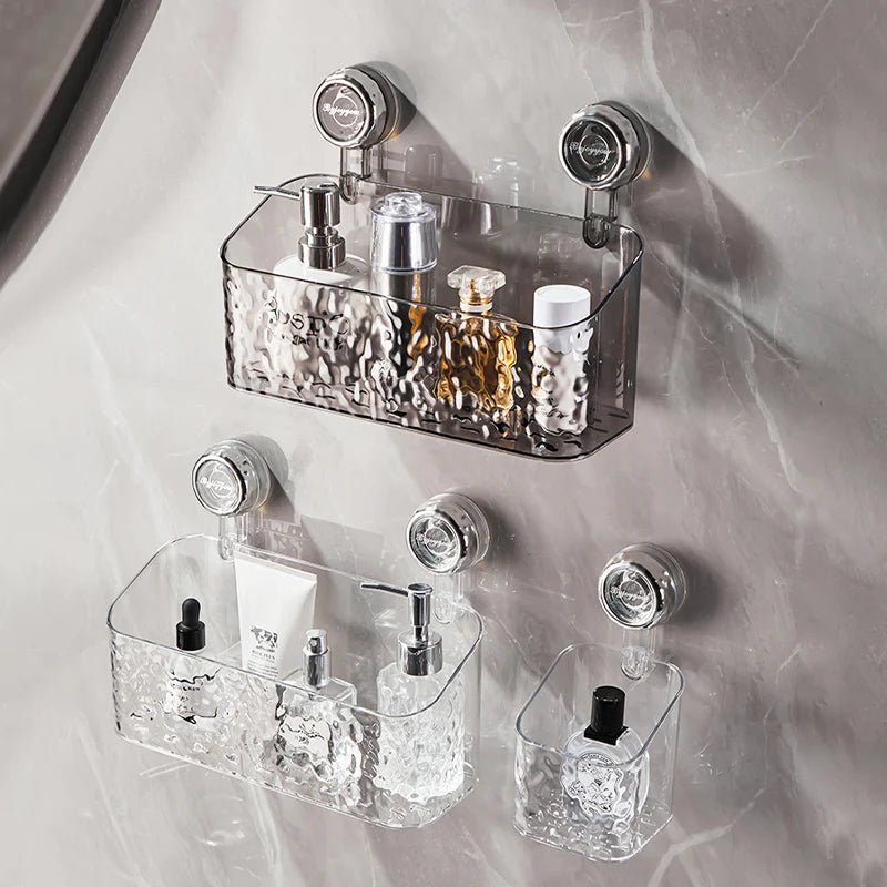 Three-tier transparent bathroom organizer mounted on marble wall