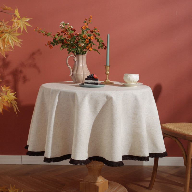 Textured cream tablecloth set for elegant indoor dining occasion