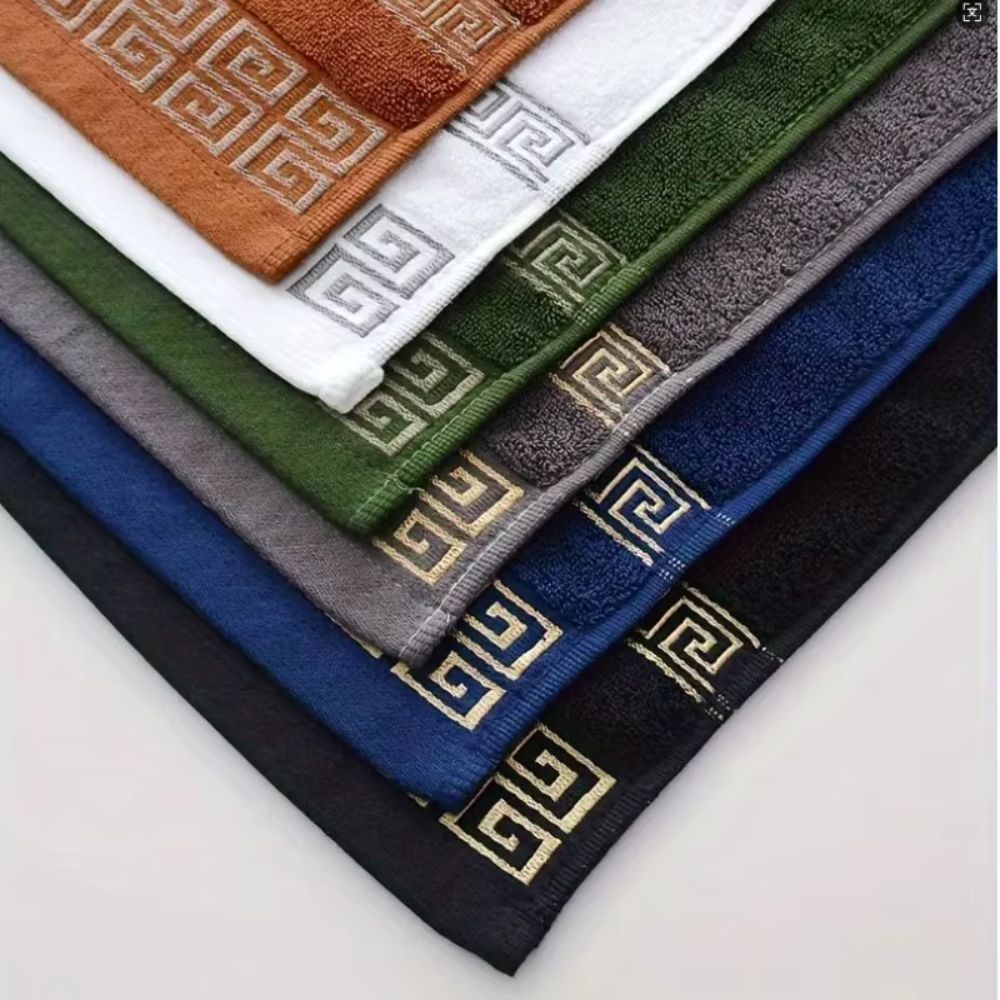 Fanned towel samples in rust white green gray navy and black with gold borders