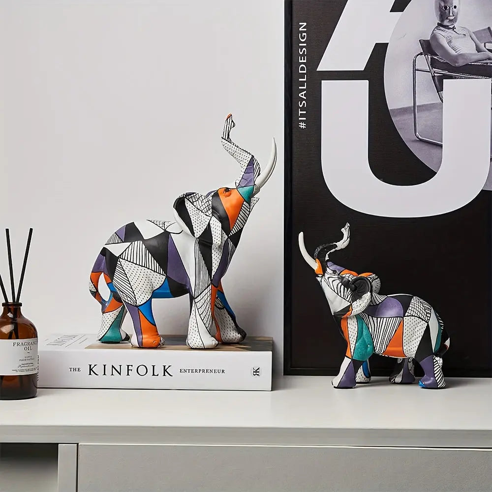 Colorful geometric elephant figurine with abstract pop art patterns on book display