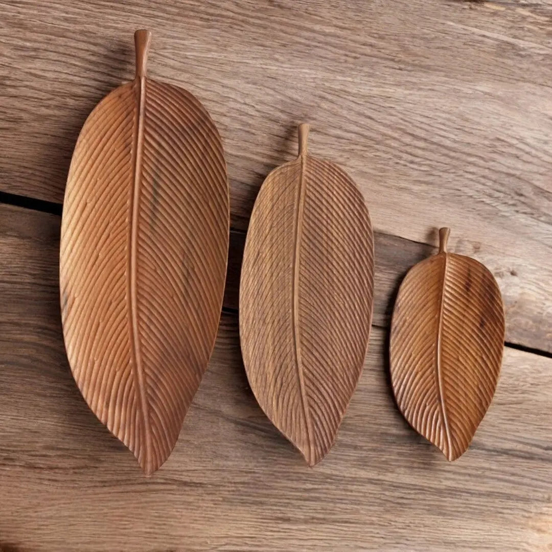 Set of three natural hardwood leaf trays in varying sizes