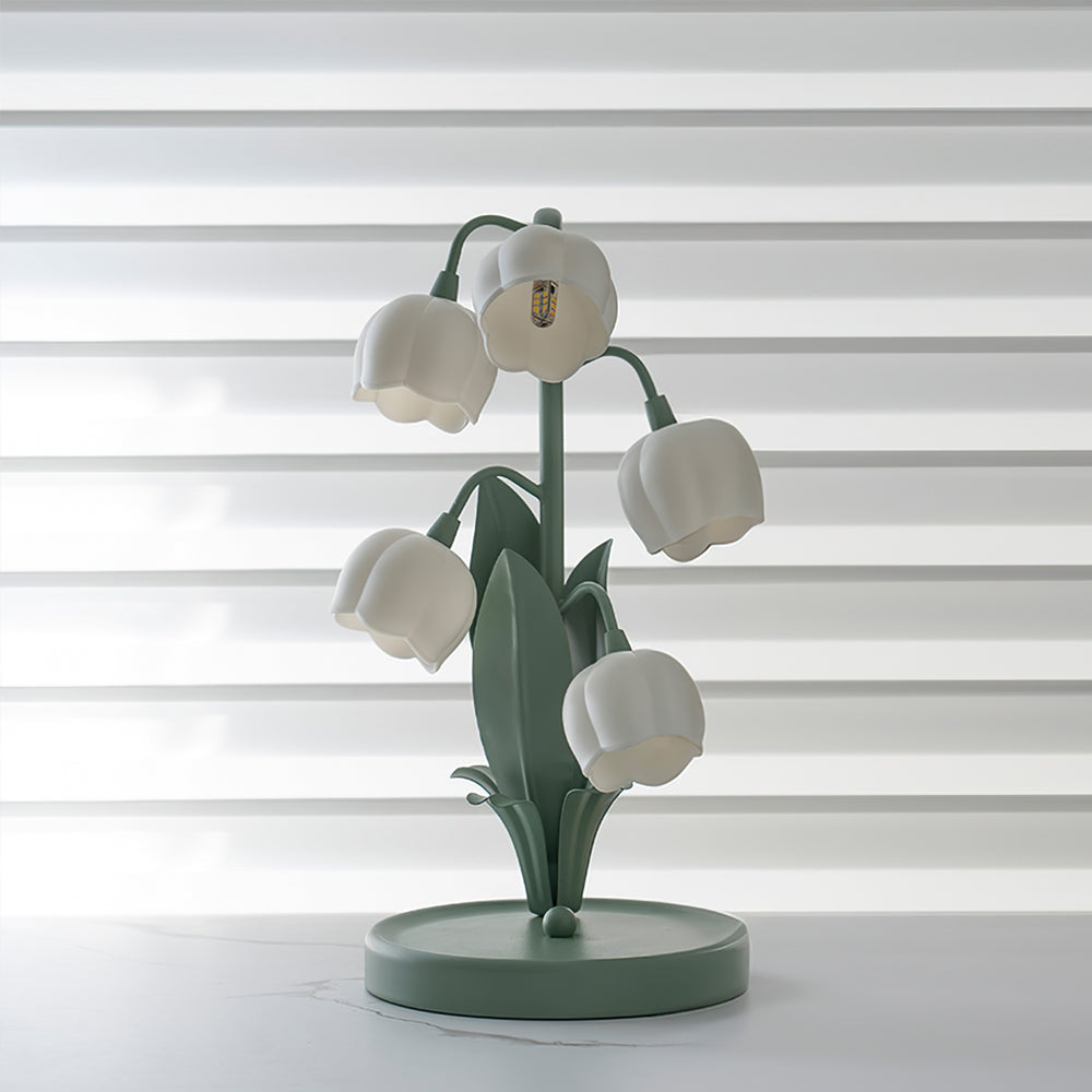 Unlit botanical desk lamp featuring sculpted leaf details and frosted flower glass shades