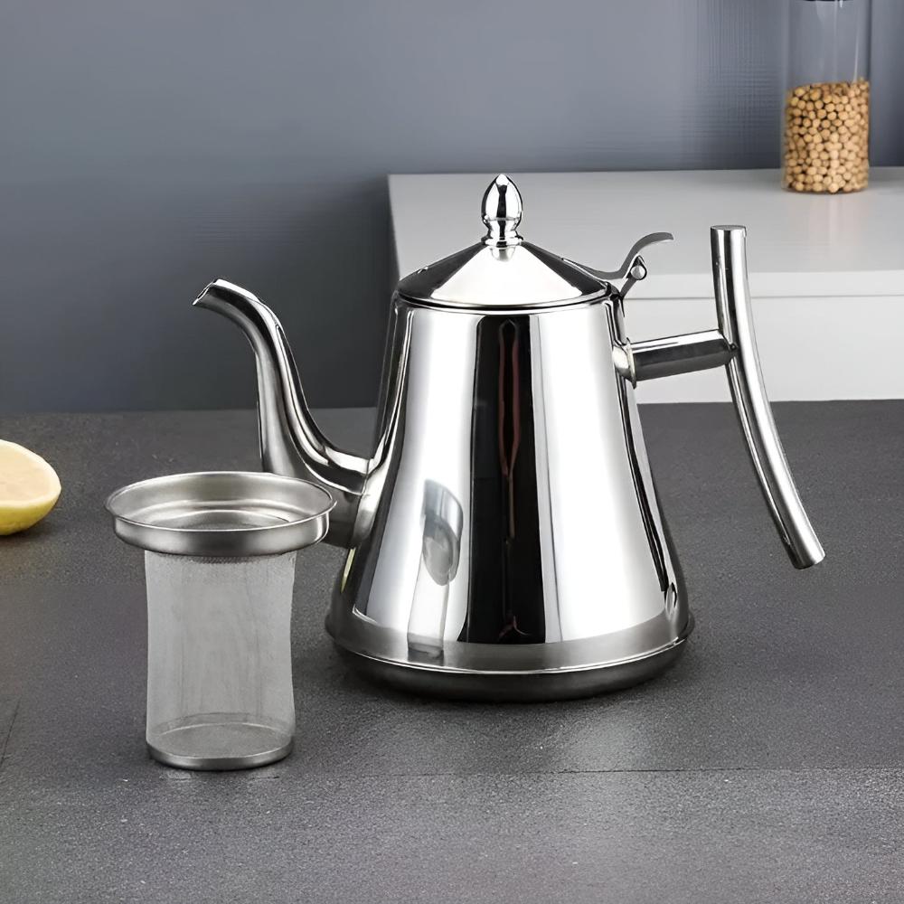 Stainless steel tea kettle with removable fine mesh filter on dark countertop