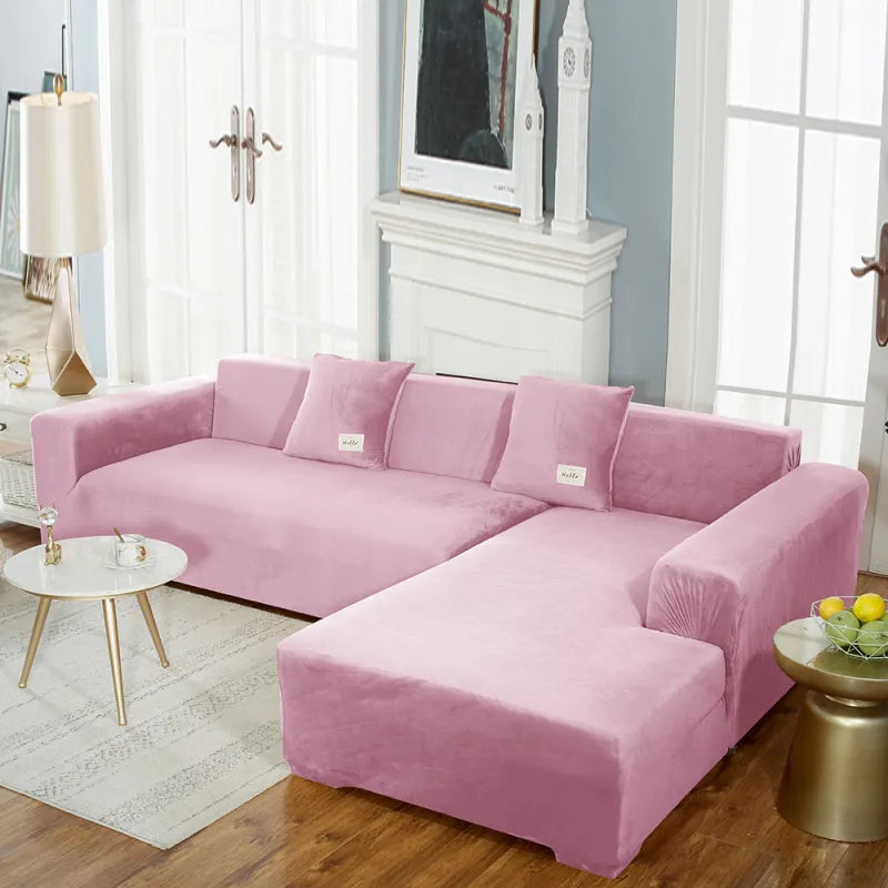 Light pink stretch velvet sofa cover on sectional with gentle pleating