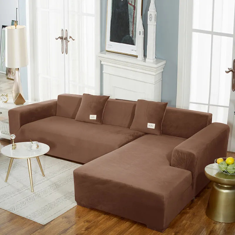Brown stretch velvet sofa cover on sectional with visible seams and fit