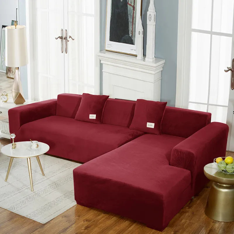 Burgundy stretch velvet sofa cover on sectional with close-fitting design