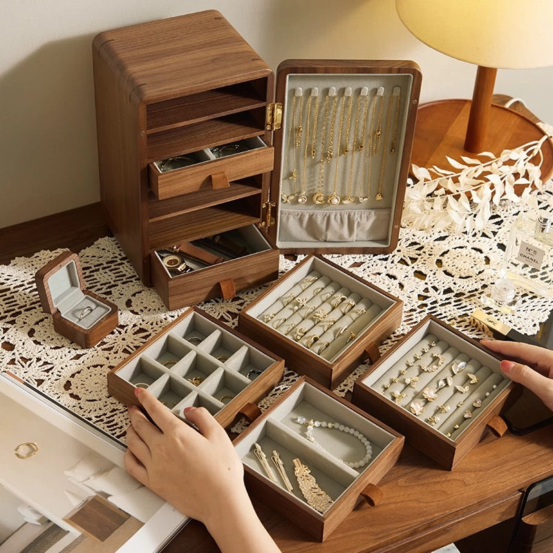 Open multi-drawer walnut jewelry organizer with removable trays