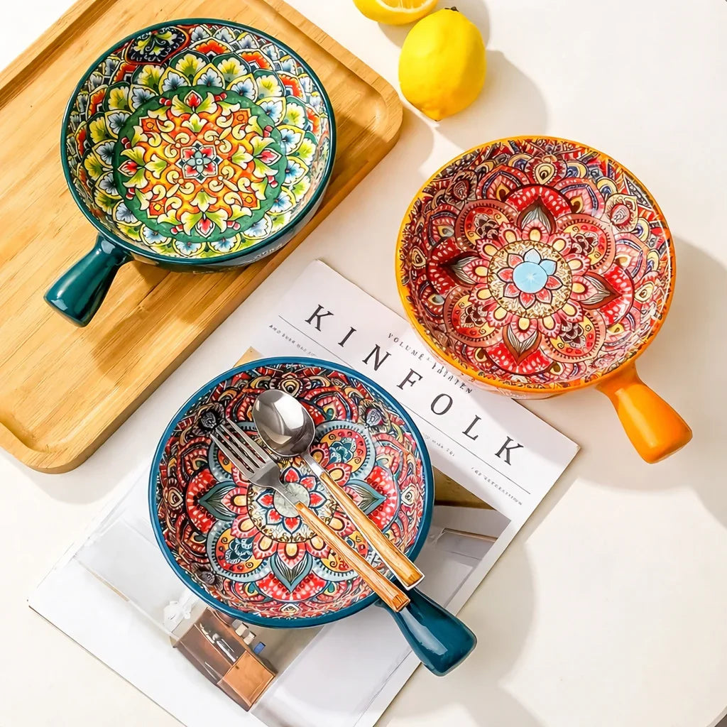 Bohemian ceramic soup bowls with handles styled on wooden tray with cutlery and lemon for serving