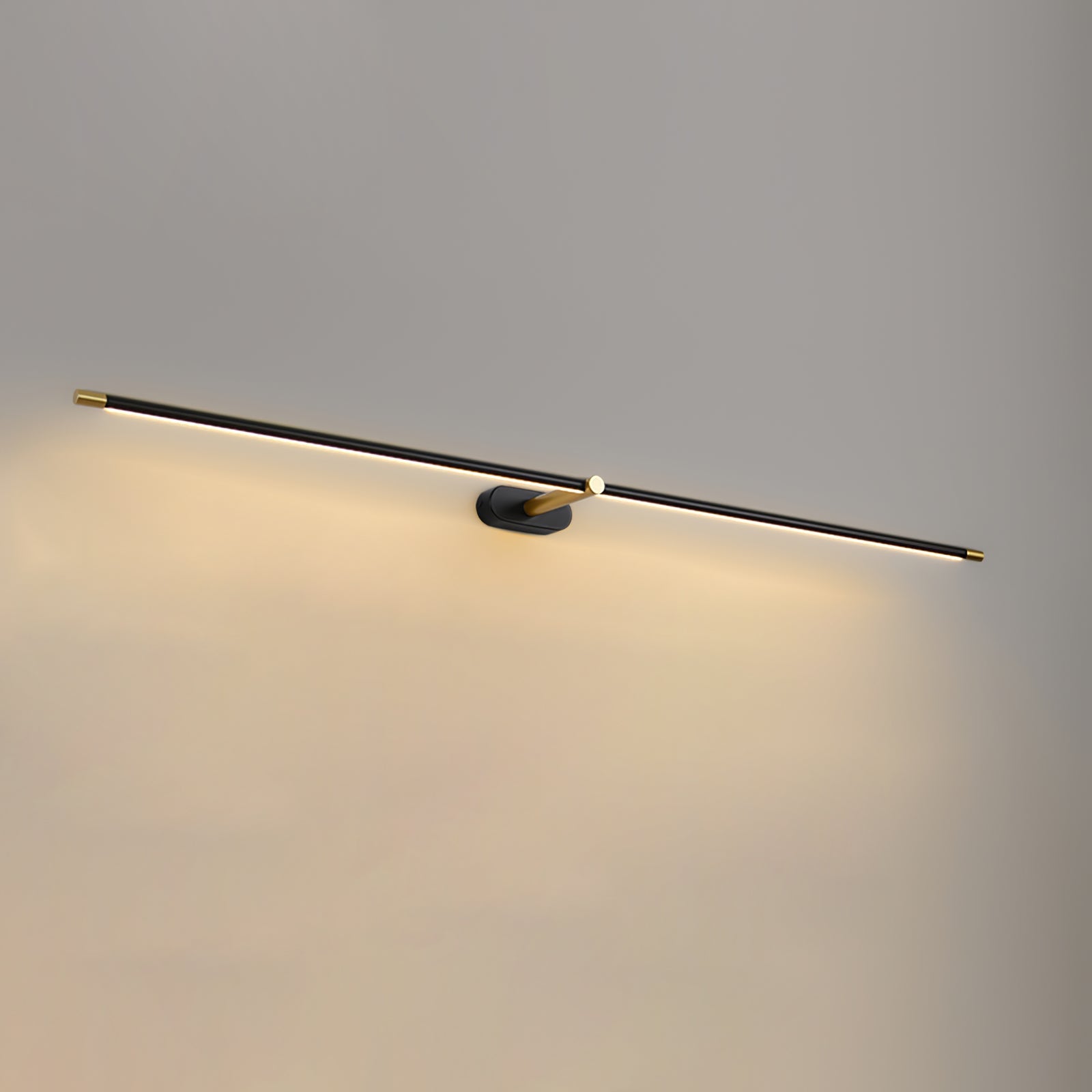 Illuminated minimalist linear wall lamp showing warm downward wash of light