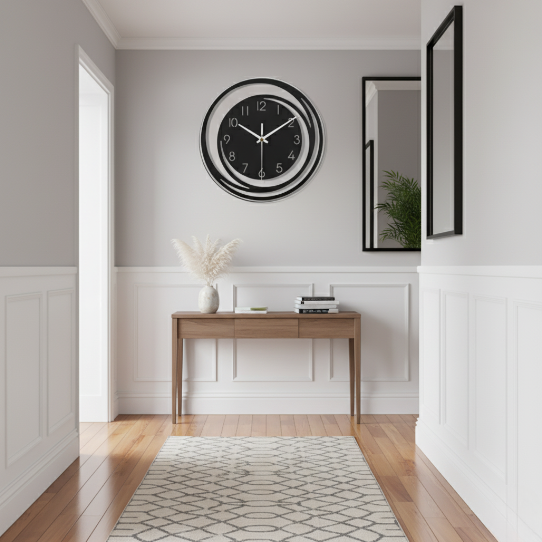 Modern black acrylic wall clock with geometric cutouts on hallway wall