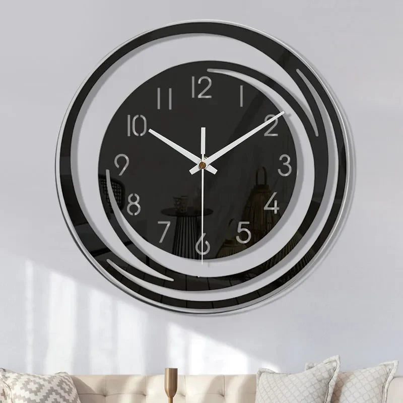 Front view of minimalist black acrylic clock with gold pivot