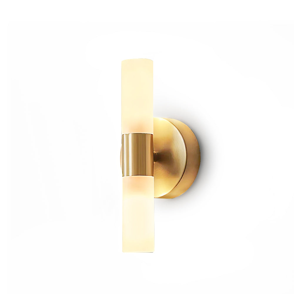 Close-up of modern brass wall sconce showing brushed finish detail