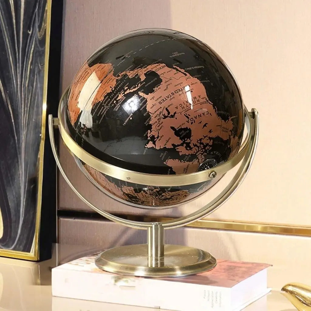 Glossy black globe with copper continents on brass frame