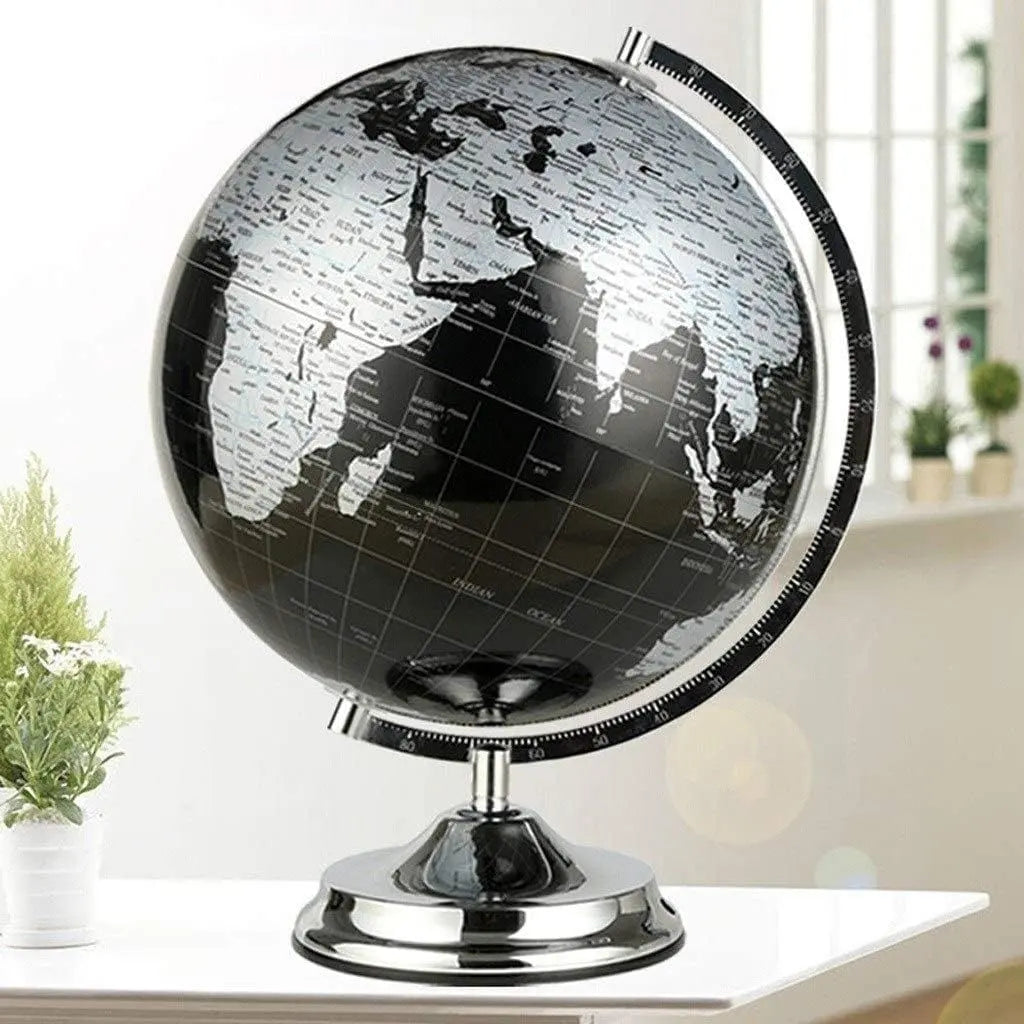 Rotating world globe with degree markings on chrome base