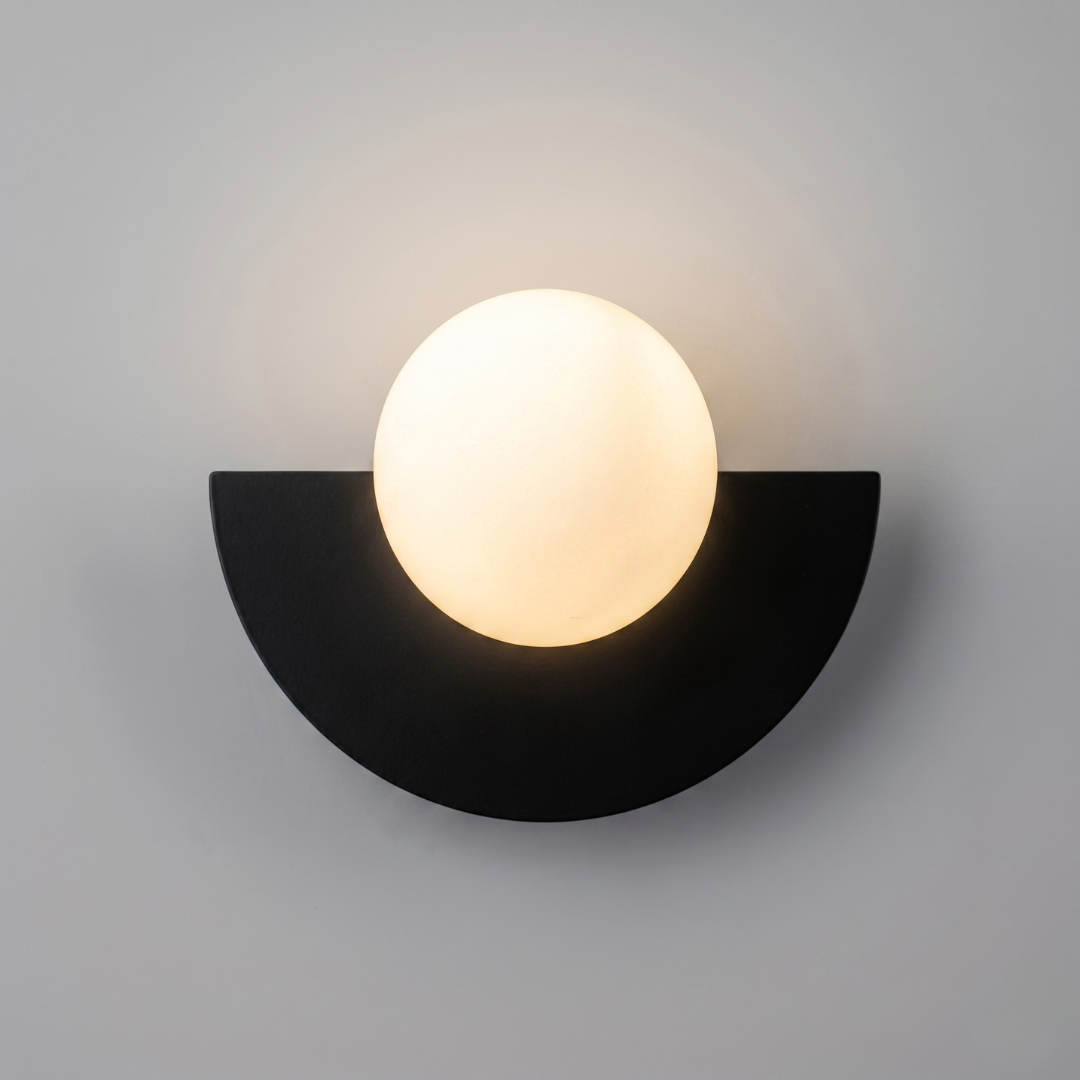 Black matte base LED wall sconce with central opaque white plastic ball lampshade