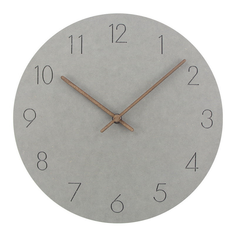 Grey dial wall clock close-up with dark brown wooden hands