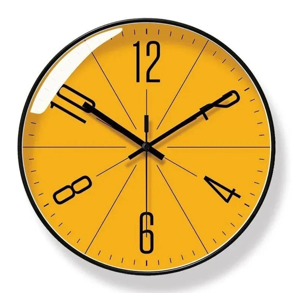 Studio shot of large yellow minimalist wall clock with abstract dial design on white background