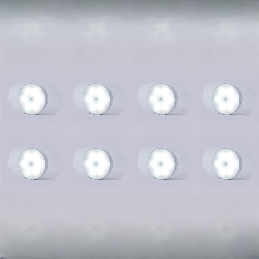 Eight stick-on LED night lights emitting bright cool white light for closets