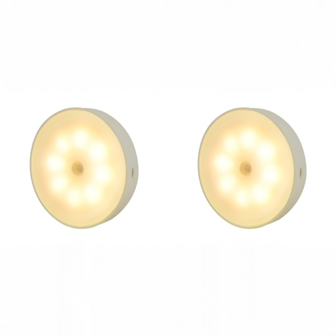 Two round adhesive LED night lights with visible USB charging ports