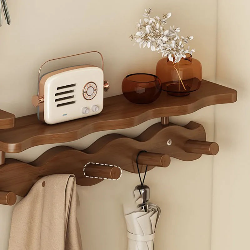 Side view of textured bamboo wall rack showing smooth finish and curved hook detail