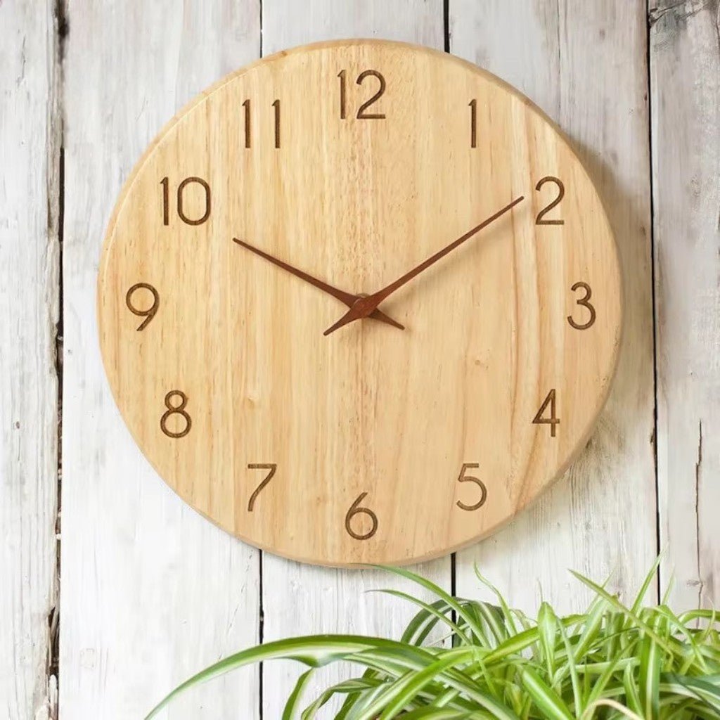 Recessed numeral wooden wall clock on weathered plank wall with spider plant